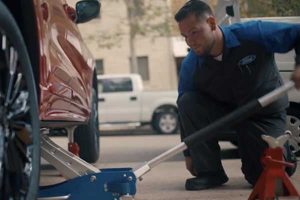 Ford Mobile Service Mechanic Working on Car at Customers Home